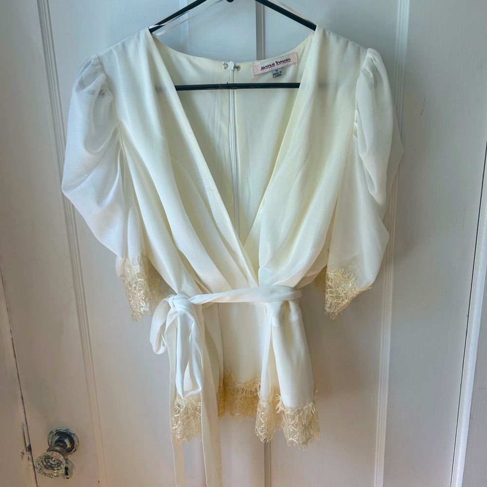 Cream top with lace detail. Size m